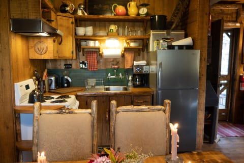 Viewing Kitchen from far side of dining table.