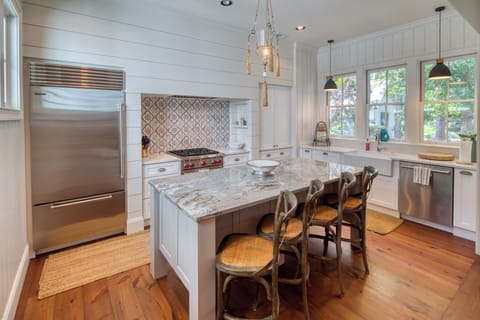 kitchen area with bar stools