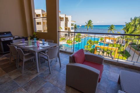 Private balcony with BBQ, table for eating and comfortable lounging area