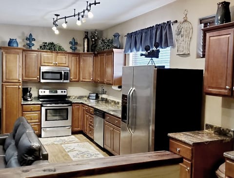 Full size kitchen plenty of counter space, pantry extra cabinets 
