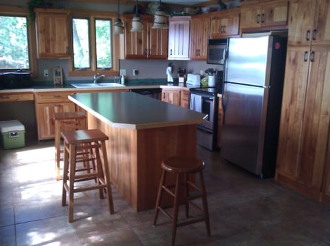 Kitchen and island. Lake view to the left