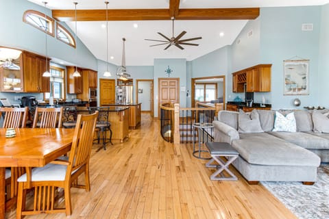 Open floor plan showing living room, dining area, and kitchen