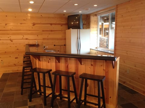 Kitchenette, bar area in basement.  (Along with full bath, bedroom area, tables)