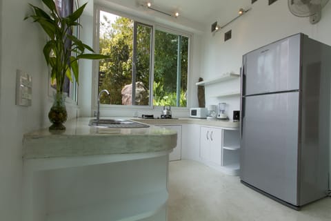 The "Gardenia" villa has a nicely appointed private kitchen, with big fridge!