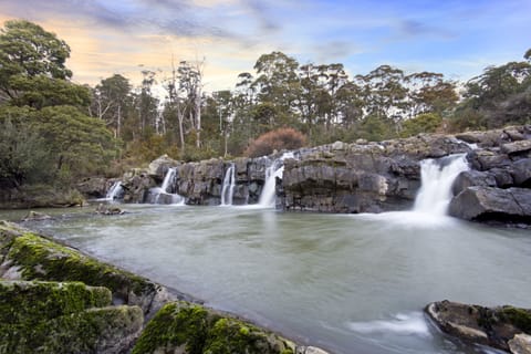 Waterfall in front of the deck at Falls River Accommodation