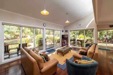"Cozy haven: Living room with warm ambiance and a gas log fire.