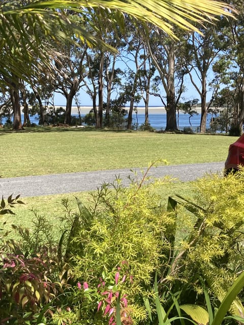 Look across the lawn to the lake and all the way to the ocean