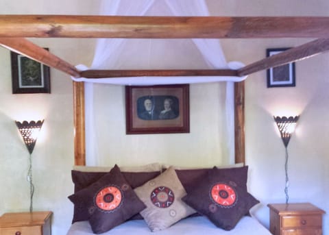 Four Poster Double Bed with mosquito net.