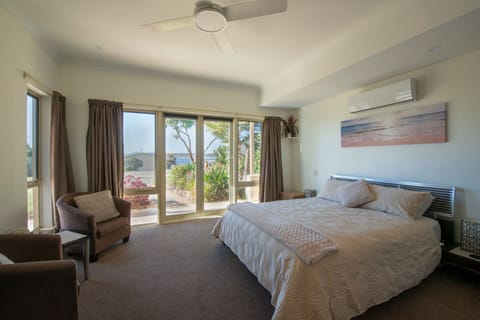 Spacious master bedroom with reading corner and sea views. 