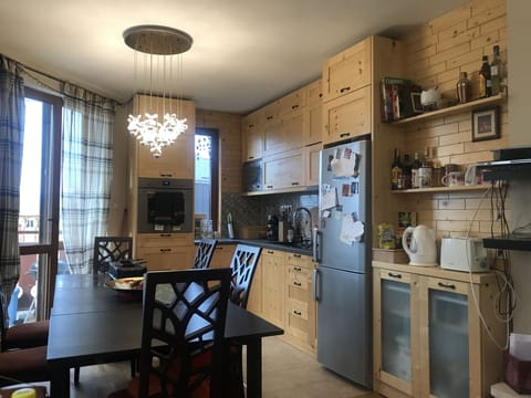 Kitchen with balcony to the left. There is a BBQ on this balcony.