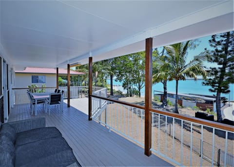 View to the beach and huge sand spit for family walking  from upstairs verandah 