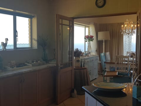 View from the kitchen / one can see the dining room / 180 degree sea view