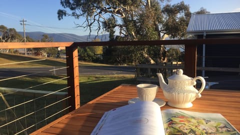 MORNING TEA - done right, with a good read and your favourite cuppa. Nice view!
