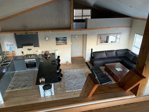 Looking down from loft onto lounge/kitchen