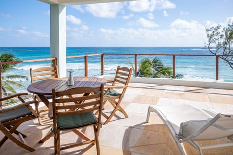 Spacious terrasse with 2 beach beds, table and Weber gas BBQ
