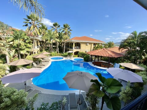 Pool area with pool for adults, kids and one jacuzzi.