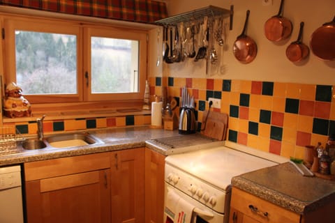 A very well equipped kitchen leading off the dinning room.