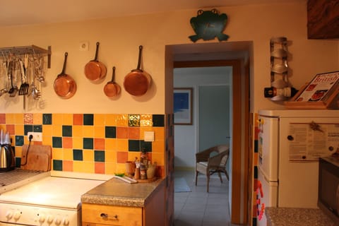 Kitchen leading to a larder, separate WC & downstairs bathroom.