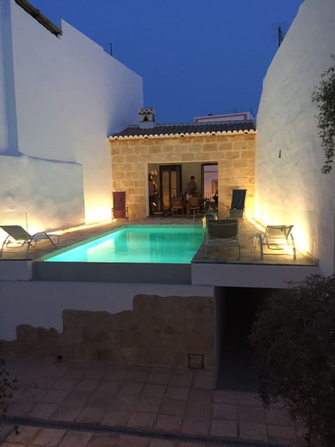 The pool is lit at night - looks amazing