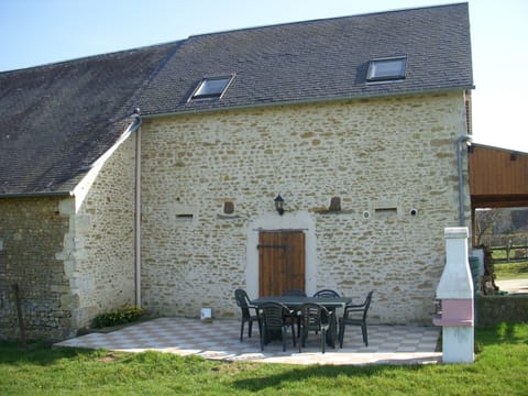 Rear view Old Stable Gite showing private patio with BBQ and table/chairs