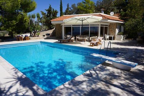 The pool house and its beautiful patio