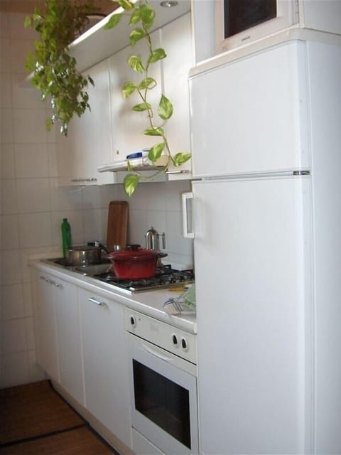 view of one side of kitchen (has large window)