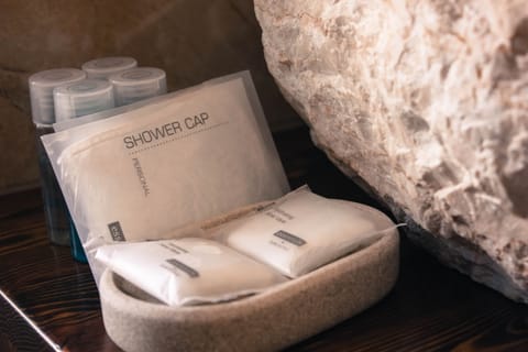 Bath soap, shampoo, hand soap and shower cap ready for our guests 