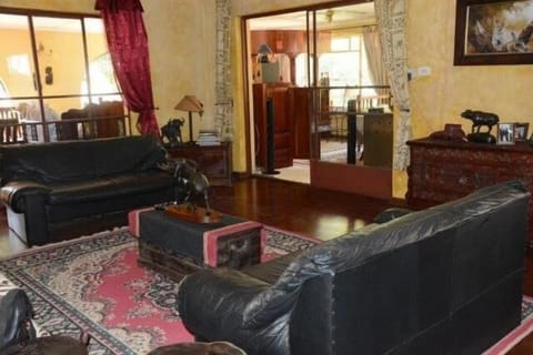 Main Lounge leading out to bar, TV and second lounge area
