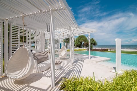 Relax in one of the swing sets by the pool or walk a few steps to the beach