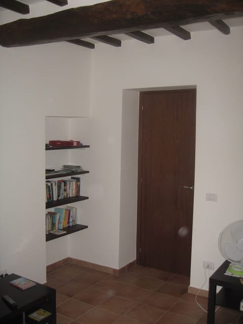 Lounge showing bookshelves / beams