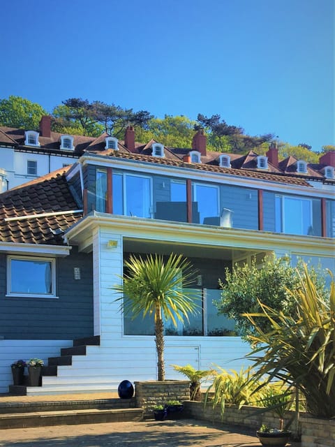 rear view looking out to sea with large balcony and downstairs terrace