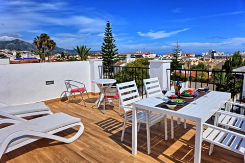 Private roof terrace with panoramic views over the mountains, town and sea.