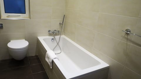 Main bathroom with bath