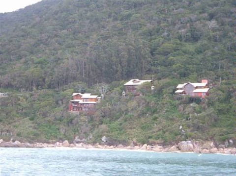 It is the middle house, on top