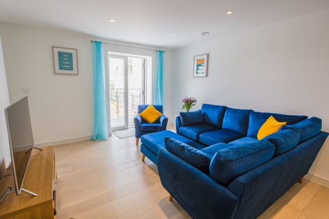 Lounge with doors leading to balcony