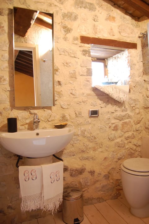 Full bath on middle floor has shower enclosure