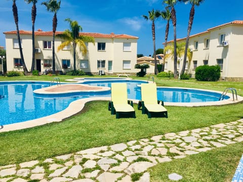 relax on our deckchairs by the pool