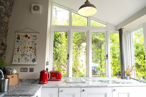 The open-plan kitchen looks out onto the private courtyard and dining area.