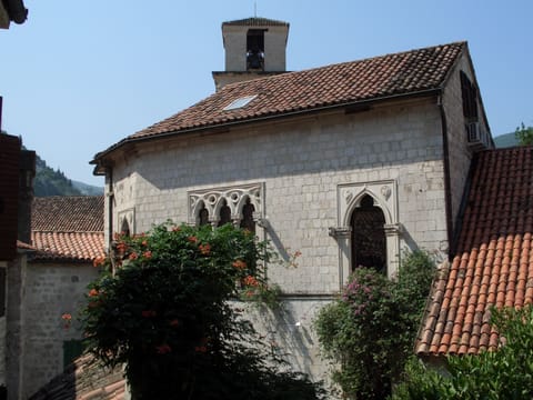 View from very small window to palace/church.