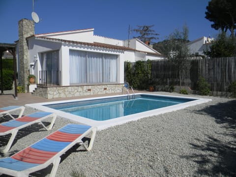 Swimming pool overlooked by conservatory