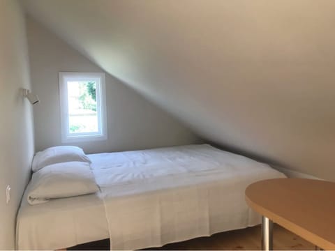 1# room with double bed & sofa with a private bathroom. The room is light.