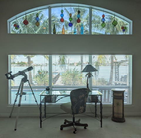 Back windows with desk facing water