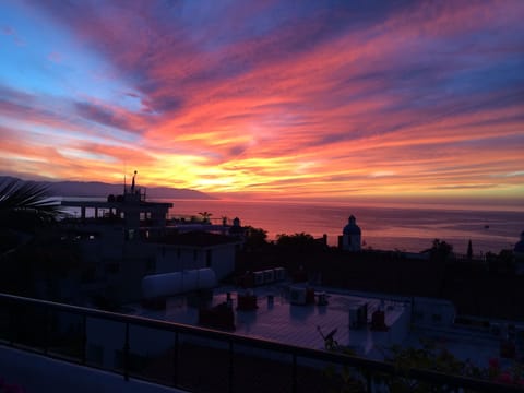 Sunset view from condo balcony overlooking Banderas Bay.