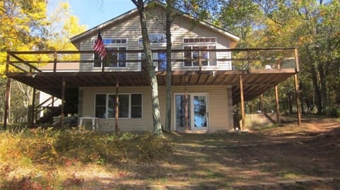 Front of cabin with wrap around deck - south facing windows.