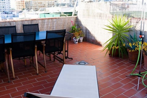 rooftop dining table w/ canopy - sunbeds - outdoor shower.