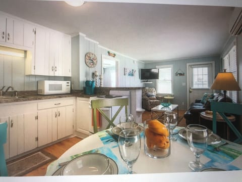 Kitchen with stove, fridge, microwave, coffeemaker, toaster, pots, pans +