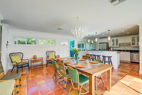 Large dining table seats 8 comfortably.  Plenty of room!  The best part is the extensive sliders that open out to the patio/pool deck.