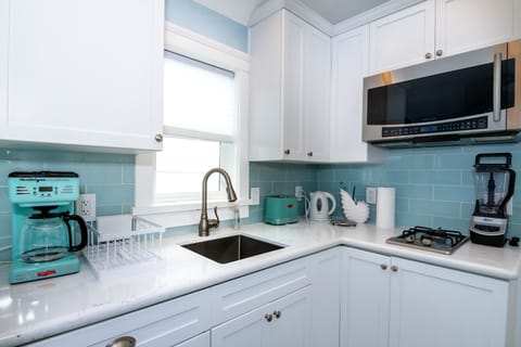 Fully stocked with coffee pot, blender, toaster