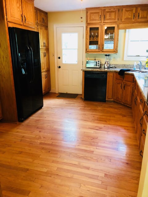 Beautiful Kitchen with Plenty of Storage and Wood Floors