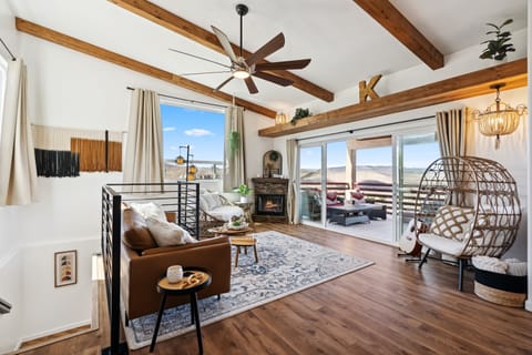 Upper Livingroom, fireplace, double sliding doors and a view of Sedona red rocks